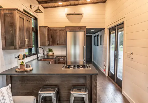 Timbercraft Big Sky model is a modern rustic and luxurious tiny home park model! detail photo 2