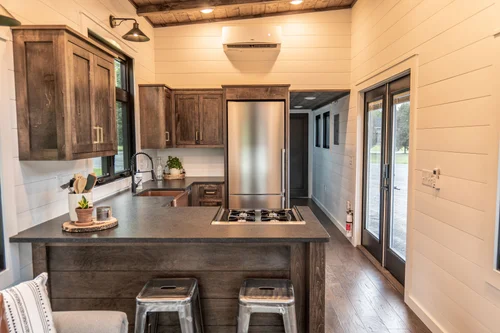 Timbercraft Big Sky model is a modern rustic and luxurious tiny home park model! image 2