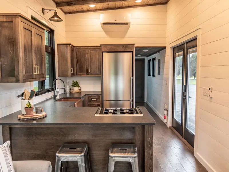 Timbercraft Big Sky model is a modern rustic and luxurious tiny home park model! photo 2