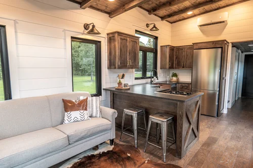 Timbercraft Big Sky model is a modern rustic and luxurious tiny home park model! image 3