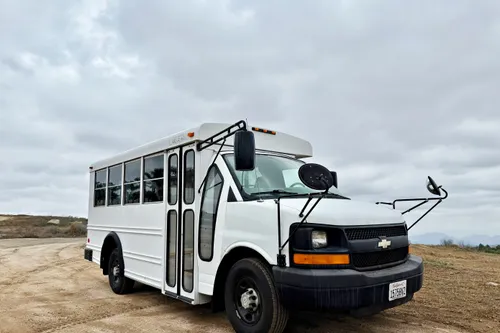 Bright Road-Ready Short Bus Tiny Home – Only 32,000 Miles!