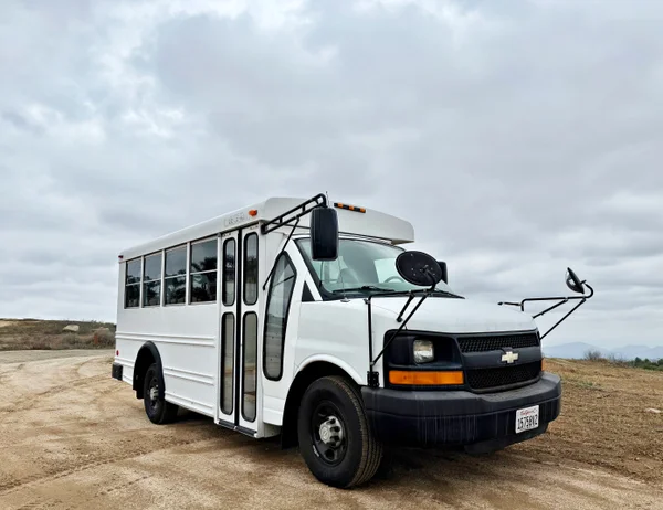 Bright Road-Ready Short Bus Tiny Home – Only 32,000 Miles!